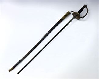 A 19th century Continental court sword.  Ornate Bronze guard and pommel with checkered Ebony grip and leather/Brass scabbard.  Touchmark at ricasso.  Wear to patina, leather scabbard split in two with wear and losses.  Blade is 24" long, 29" long overall.  ESTIMATE $100-200