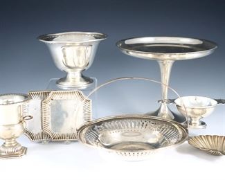 Eight pieces of 20th century American Sterling Silver by Gorham, Napier and other makers.  Includes a weighted compote, a pierced basket, two footed bowls, a toothpick urn, a shell form personal ashtray and two small trays.  Impressed marks.  11.39 troy ozs total without weighted compote.