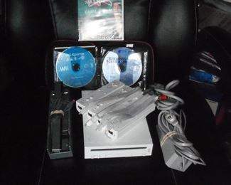Nintendo Wii game system with 4 controllers, audio bar and games