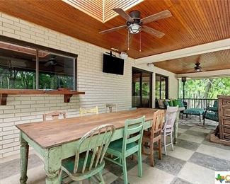 Rustic farm table with eclectic chairs
