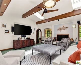 75 inch Smart TV. Carved credenza with marble top.