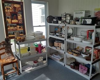 Ello stainless water bottle, large meat platters, mugs, coffee pot, table lazy susan, mini crocks, Sears Insta Blend, Toastmaster, Black & Decker hand mixer, Tupperware, Corningware, cook books, GE slow cooker, (new) Crock Pot Smart-Pot, stainless large double boiler, Flint stainless pots, enamel cookware, Nesco electric roaster, Pampered Chef clay pizza baker, 