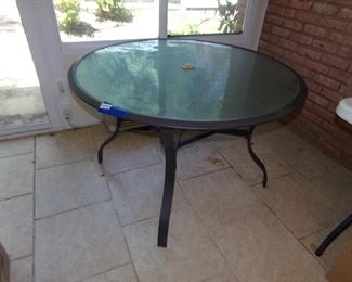 glass top umbrella patio table  used indoors