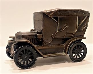 Vintage Stanley Steamer automobile coin bank........To register in order to place bids go to www.capitolsalesservices.hibid.com