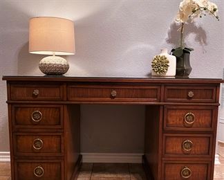 A kneehole desk by Henredon .......To register in order to place bids go to www.capitolsalesservices.hibid.com