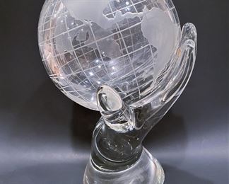 Heavy vintage art glass sculpture of a hand holding a globe.  12 & 3/4 ins tall.  