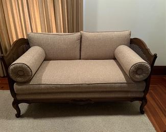 Vintage French Provincial loveseat reupholstered in a neutral color.