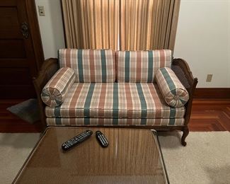 Vintage French Provincial loveseat reupholstered in a plaid fabric