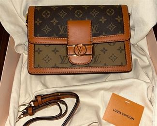 #152	Louis Vuitton Dauphine Shoulder Bag MM Brown Leather Monogram Reverse Product Details 9.8x6.7x4,1 inches , Monogram and monogram revierse coated canvas, cawhide leather trim,  Microfiber lining, gold color hardware, Magnetized front lock,  2 inside compartments, middle zipped pocket, inside back flat pocket, multiple carrying options, strap removable adjustment, strap drop 9.8, strap drop max 17.7 inches, chain removable 	 $2,000.00 			
