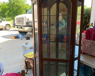 #102	Cherry stain Corner display cabinet 21x31x78"h Beveled glass door 4 glass shelves	 $125.00 			
