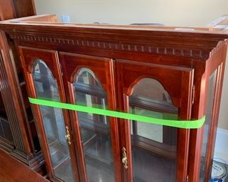 #104	Sumter China Cabinet (2pc) 3 doors 50x18x34 Hutch 3 beveled glass doors 51x16x49" lighted	 $150.00 			
This was moved from in the house to garage for easy moving. 