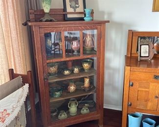 Signed  Limbert One-Door China Cabinet.  Excellent original finish filled with Roseville art pottery.  61″h x 34″w x 16″d 