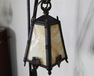 Another view of Antique wrought iron Arts and Crafts style floor or bridge lamp with caramel slag glass hanging shade.  61 1/2" tall overall, 47" from floor to bottom of shade