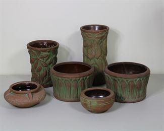 Large group of Peters and Reed Moss Azteca pottery including hanging bowl, planter, dragonfly bowl, and vases