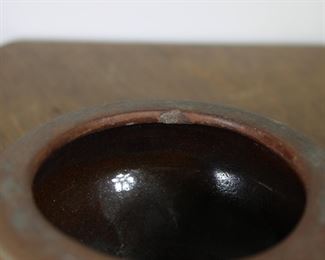 Another view showing inner rim chip on Peters and Reed Moss Azteca Dragonfly pottery bowl