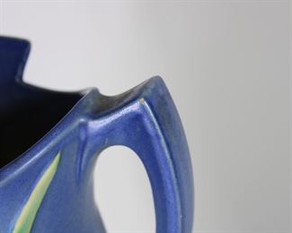 Another view of Roseville Pottery Freesia pitcher in blue, #20-10".  Tiny glaze nick on point on handle