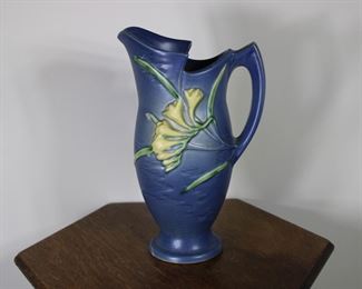 Another view of Roseville Pottery Freesia pitcher in blue, #20-10".  Tiny glaze nick on point on handle