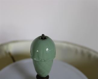 Finial is missing its threaded tip on the c. 1940's celadon glazed table lamp