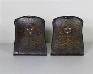 23.  $175.00  Craftsman Studios hammered copper Arts and Crafts bookends