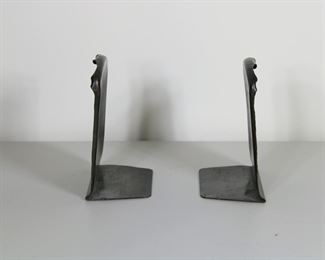 23.  $175.00  Craftsman Studios hammered copper Arts and Crafts bookends
