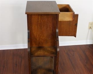 29.  Oak smoking stand with drawer and bookshelves.  30” tall, 25” across,  11 1/2” deep