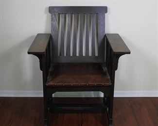 Prairie School design oak arm chair in original finish with original leather seat. 29” wide, 24” deep, 36” tall