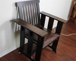 Prairie School design oak arm chair in original finish with original leather seat. 29” wide, 24” deep, 36” tall