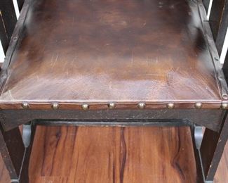 Prairie School design oak arm chair in original finish with original leather seat. 29” wide, 24” deep, 36” tall