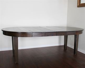 45" Mission Style Oak dining table with four 10" leaves.  Extends to 85" long, old refinish, two of the leaves appear original, two appear to be made at a later date