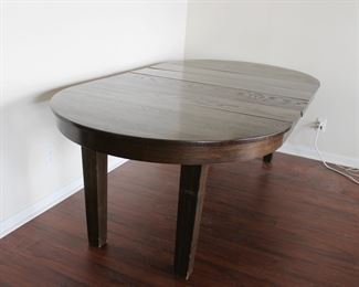 45" Mission Style Oak dining table with four 10" leaves.  Extends to 85" long, old refinish, two of the leaves appear original, two appear to be made at a later date