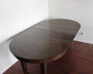 45" Mission Style Oak dining table with four 10" leaves.  Extends to 85" long, old refinish, two of the leaves appear original, two appear to be made at a later date