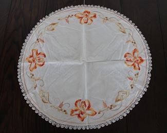 Round Arts and Crafts style hand embroidered table cloth with Iris