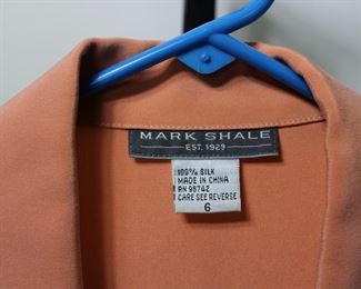Label on Mark Shale size 6 silk blouse.   We have racks of great, like new women's clothes size small to medium, vintage to current trend!