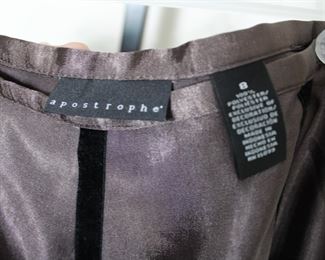 Label on apostrophe size 8 skirt.  We have racks of great, like new women's clothes size small to medium, vintage to current trend!