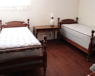 Lovely pair of cherry wood twin beds with clean Sealy mattresses and box springs