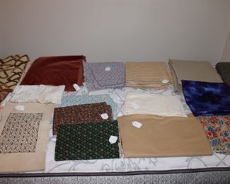 Sewing fabrics in cotton, some silk, and wool mohair upholstery fabric -- enough for a bench or some chair seats