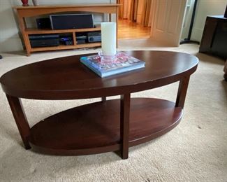 Oval coffee table is 44" by 21" by 18" tall.