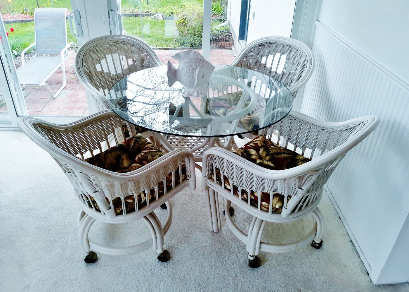 Glass and rattan patio set