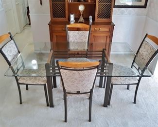 Glass, metal, and wood dining set