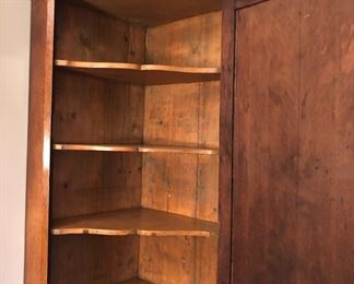 Interior of oak corner cabinet