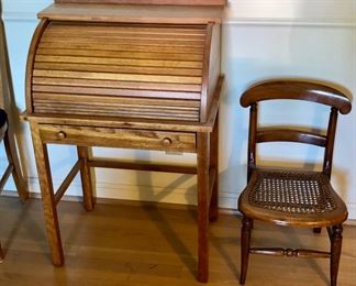 Vintage child’s oak roll top desk (23”W, 15”D, 33.5”H),  Victorian child’s chair with cane seat (24” high at back) 