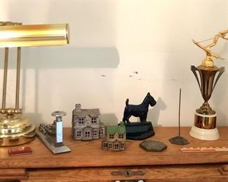 Old cast iron house banks, Scottie book end, vintage ski trophies