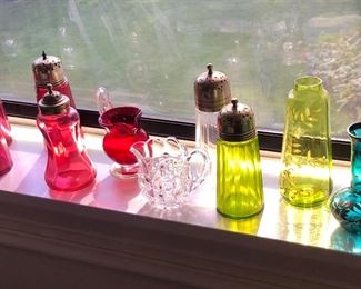 Colorful glass - cranberry & green pitchers + muffineers