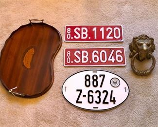 Antique inlaid wood tray, German & Belgian license plates, brass lion door knocker