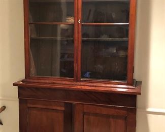 Mid-Victorian mahogany china cabinet with original glass, circa 1845. Upper shelves are adjustable & top section lifts off for transport (85”H, 40”W, 15.5” D)