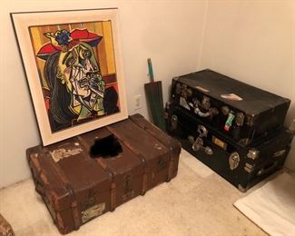 Old trunks, framed Picasso poster