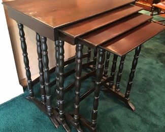 Set of 4 nesting tables with mahogany tops, circa 1920s. Smaller ones side  completely under biggest one (we pulled’em out for photo) Biggest table is 26”L, 17”D, 28”H. 