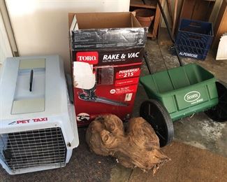Dog crate, new-in-box Toro Rake & Vac (electric blower vac), big wooden burl, seed spreader