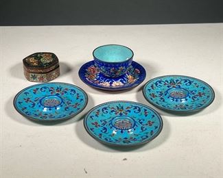 (6PC) CHINESE CLOISONNÉ  |  Including a Peking cup and matching saucer in deep blue enamel decorated with fruits and flowers (dia. 4.5 in.), plus three saucers with Shou character, and a small 19th century enameled lidded box (dia. 2.5 in.)