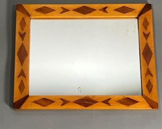 FOLK ART MIRROR  |  Antique folk art mirror with inlaid contrasting wood diamonds and geometric devices. 
Dimensions: w. 12.5 x h. 15.75 in (overall)